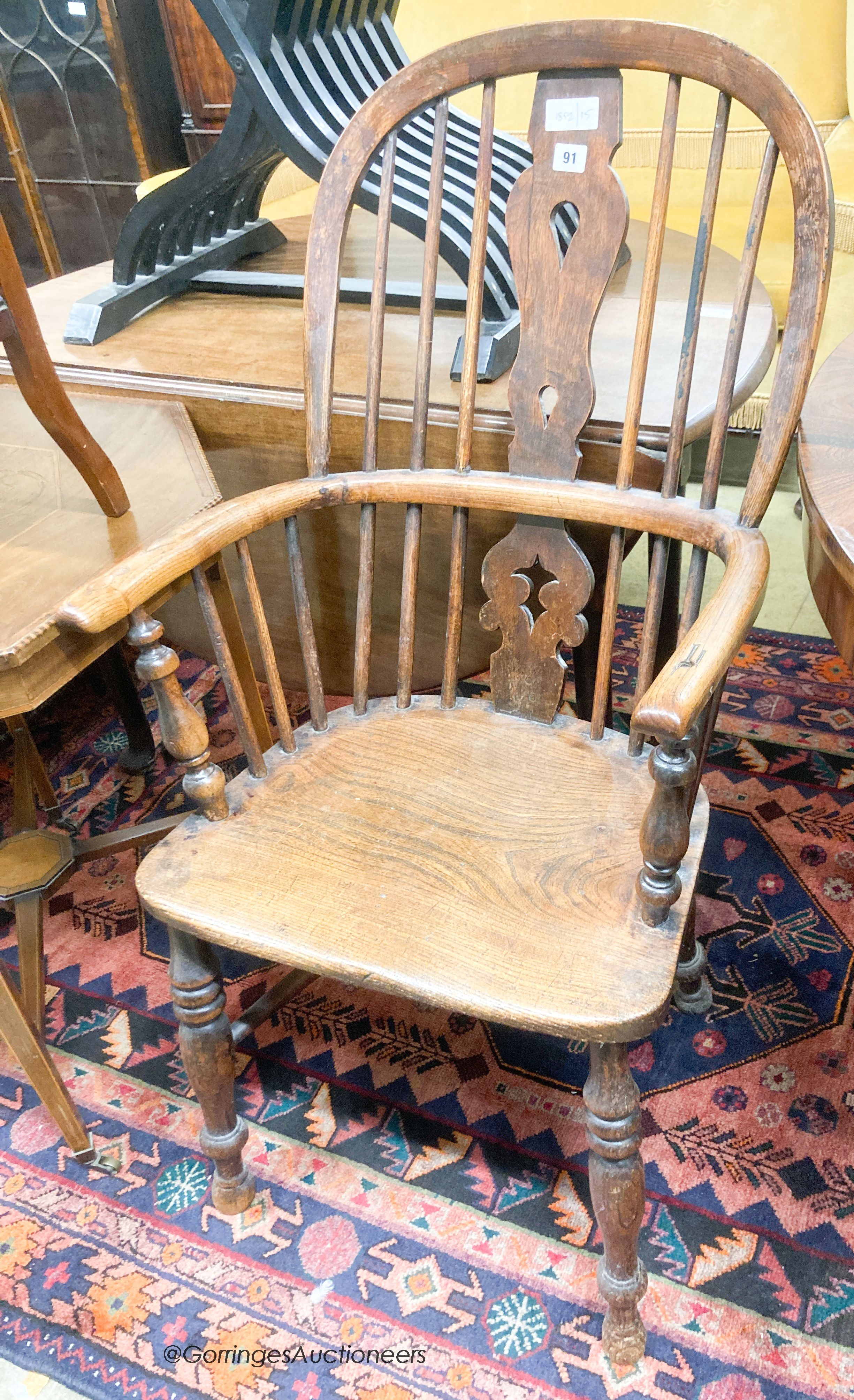 A Victorian elm and ash Windsor armchair, width 54cm, depth 44cm, height 108cm